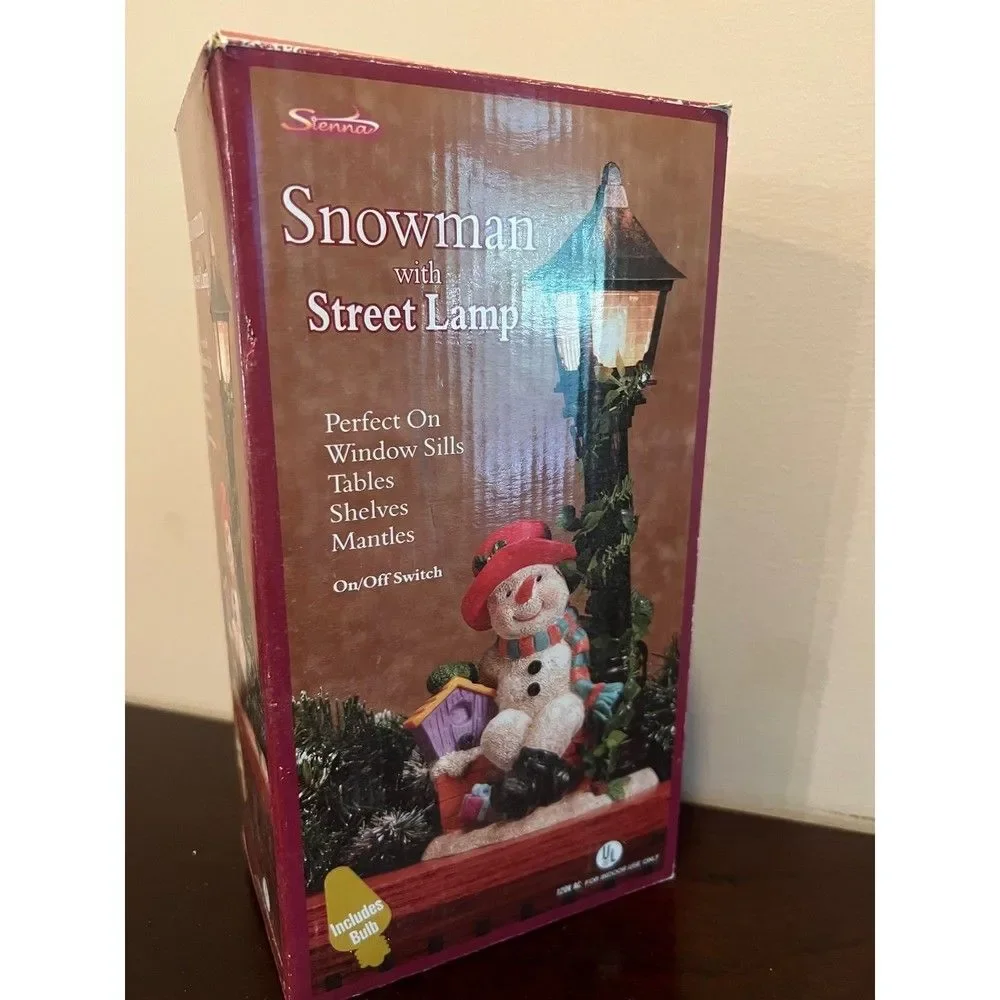 Snowman with flickering street lamp